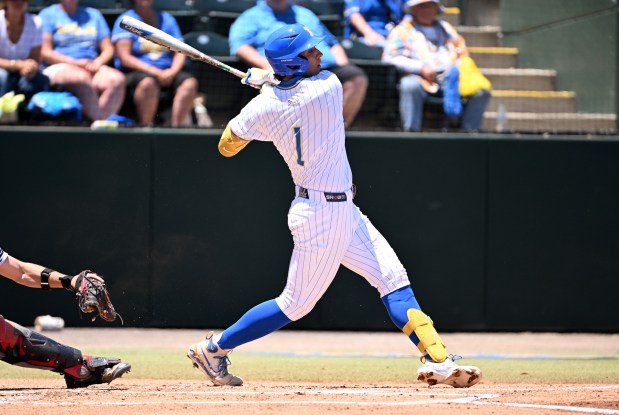 UCLA's Roch Cholowsky hits a sacrifice fly against Saint Mary's in the fifth inning of an NCAA regional game May 29, 2026, at Jackie Robinson Stadium in Los Angeles. (Keith Birmingham/Pasadena Star-News)