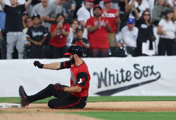 White Sox center fielder Tristan Peters slides into third base for a two-run triple in the fifth inning against the Dodgers on June 12, 2026, at Rate Field. (John J. Kim/Chicago Tribune)