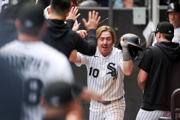 Chicago White Sox second baseman Chase Meidroth (10) gets high-fives in the dugout after scoring the go-ahead run in the seventh inning against the Detroit Tigers at Rate Field on May 31, 2026. (Eileen T. Meslar/Chicago Tribune)