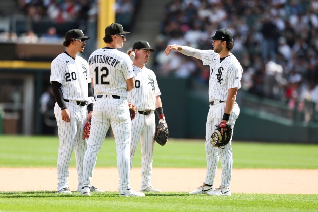 Chicago White Sox first baseman Jacob Gonzalez (7) speaks to third baseman Miguel Vargas (20), shortstop Colson Montgomery (12), and second baseman Chase Meidroth (10) in the ninth inning against the Detroit Tigers at Rate Field on May 31, 2026. (Eileen T. Meslar/Chicago Tribune)