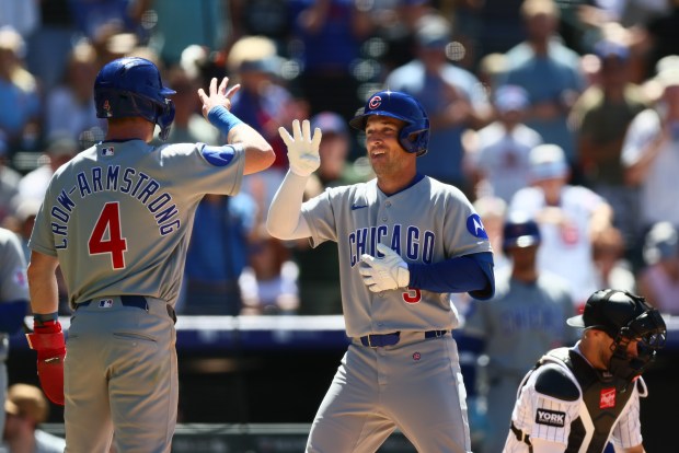 Cubs third baseman Alex Bregman, right, is congratulated at the plate by Pete Crow-Armstrong after hitting a two-run home run in the seventh inning against the Rockies at Coors Field on June 11, 2026, in Denver. (Justin Edmonds/Getty)