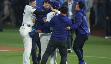 Oct 27, 2025; Los Angeles, California, USA; Los Angeles Dodgers designated hitter Shohei Ohtani (17) celebrates with pitcher Roki Sasaki (11) and pitcher Yoshinobu Yamamoto (18) after winning in the eighteenth inning against the Toronto Blue Jays in game three of the 2025 MLB World Series at Dodger Stadium. Mandatory Credit: Kiyoshi Mio-Imagn Images