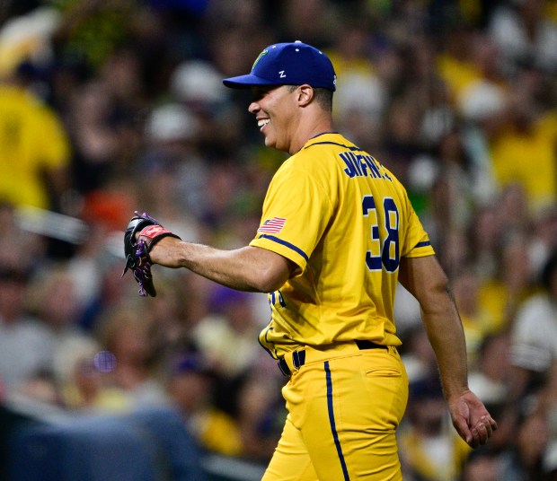 Honorary Savannah Bananas pitcher and former Colorado Rockies pitcher, Ubaldo Jiménez smiles coming off the field after making a few pitches to The Firefighters at Coors Field in Denver, on Saturday, Aug. 09, 2025. (Photo by Andy Cross/The Denver Post)