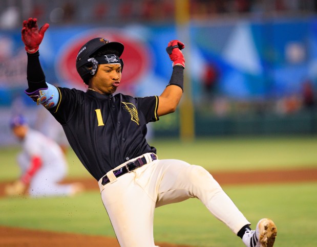 Rockies prospect Roldy Brito slides into the bag during a 2026 California League game for the Fresno Grizzlies. (Courtesy of Fresno Grizzlies)