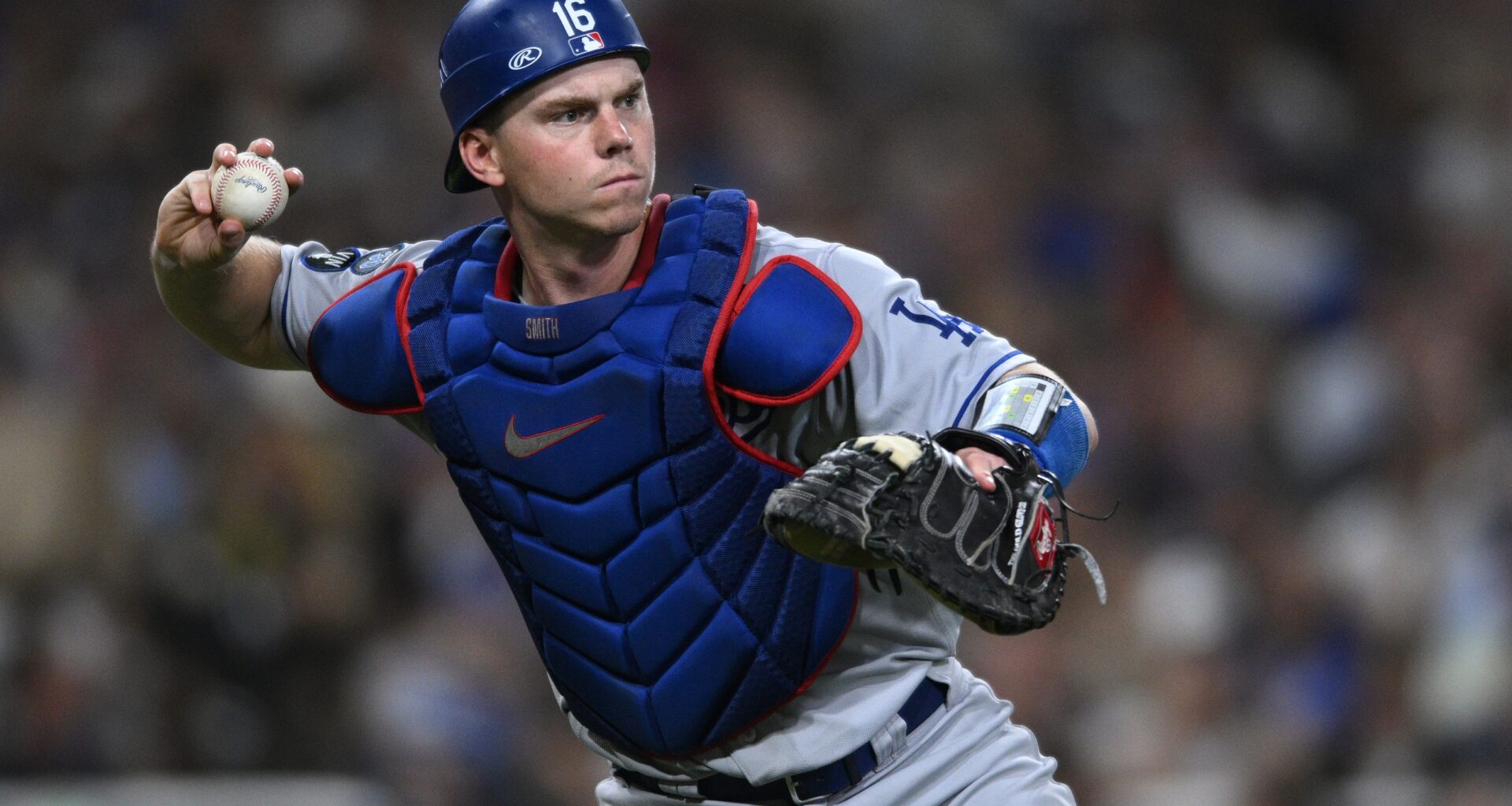 Sep 28, 2022; San Diego, California, USA; Los Angeles Dodgers catcher Will Smith (16) throws to first base on a ground out by San Diego Padres left fielder Jurickson Profar (not pictured) during the fourth inning at Petco Park. Mandatory Credit: Orlando Ramirez-USA TODAY Sports