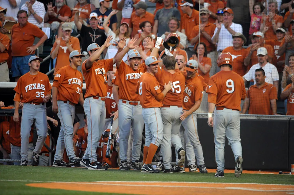 June 6, 2010; Austin, TX, USA; The Texas Longhorns congratulate designated hitter Russell Moldenhauer (15) after his two run home run against the Rice Owls during the eighth inning in the Austin regional of the 2010 NCAA baseball tournament at UFCU Disch-Falk Field. Texas beat Rice 4-1. Mandatory Credit: Brendan Maloney-USA TODAY Sports