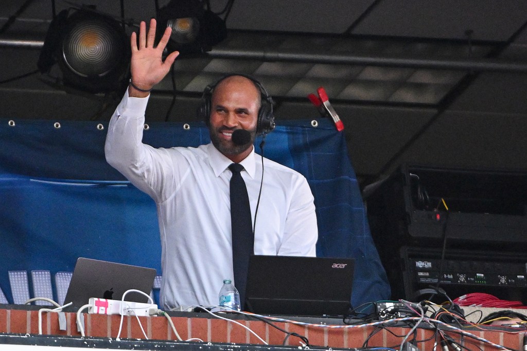 Broadcaster Albert Pujols waving to fans.