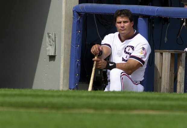 White Sox designated hitter Jose Canseco watches a game against the Rays from his spot in the dugout Aug. 4, 2001, at Comiskey Park. (Phil Velasquez/Chicago Tribune)