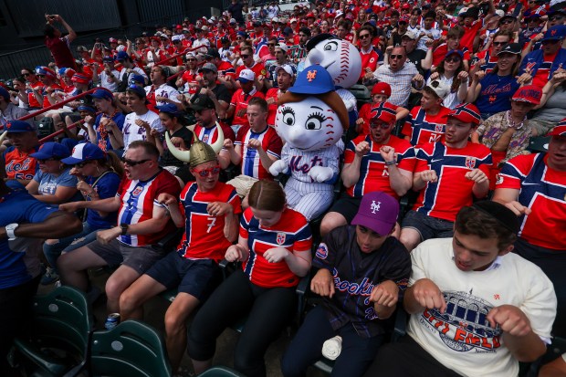 Fans of Norway's national soccer team perform a 'Viking Row' during the sixth inning between the New York Mets and the Chicago Cubs in game one of a doubleheader at Citi Field on June 24, 2026, in New York City. (Ishika Samant/Getty Images)