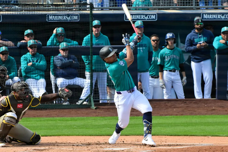 Seattle Mariners shortstop Michael Arroyo (96) hits a two run home run in the second inning against the San Diego Padres during a Spring Training game at Peoria Sports Complex. Matt Kartozian-Imagn Images