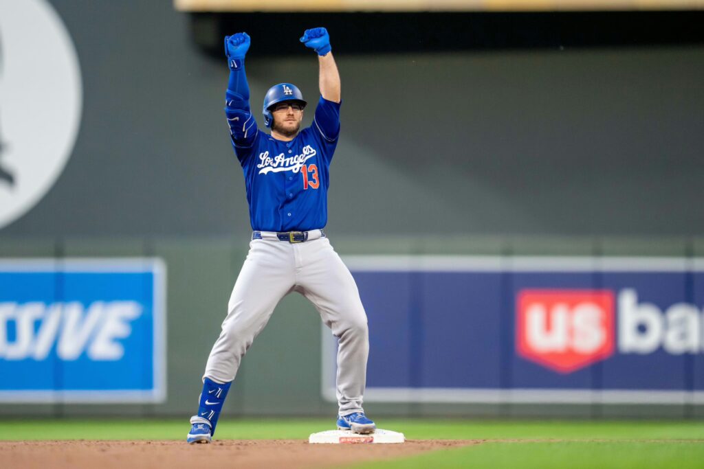 Los Angeles Dodgers third baseman Max Muncy (13) celebrates hitting a double against the Minnesota Twins in the eighth inning at Target Field.