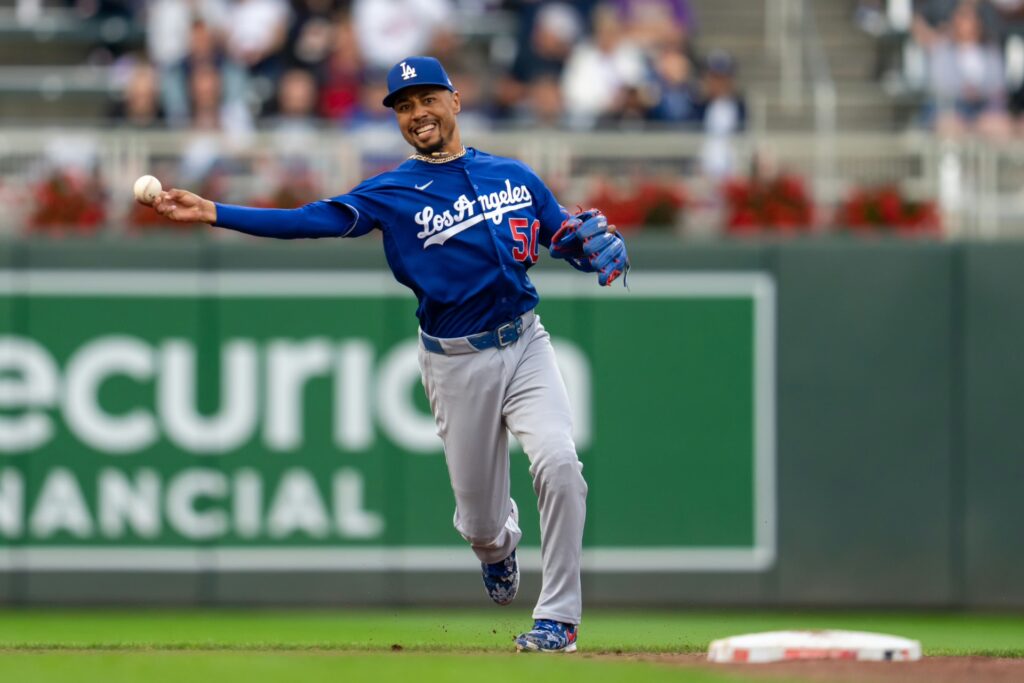 Los Angeles Dodgers shortstop Mookie Betts (50) throws the ball to first base for an out against the Minnesota Twins in the second inning at Target Field. 