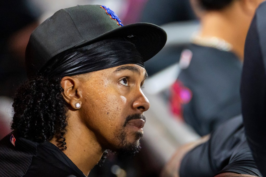 Close-up of New York Mets shortstop Francisco Lindor in the dugout.