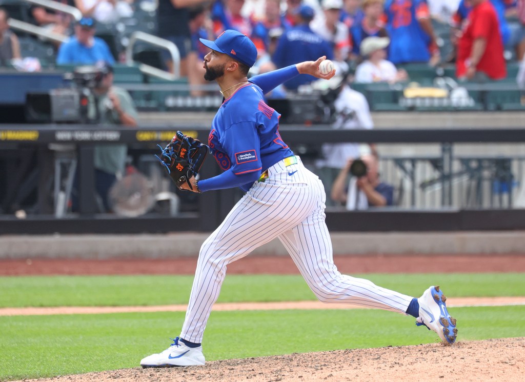 New York Mets pitcher Devin Williams pitching against the St. Louis Cardinals.