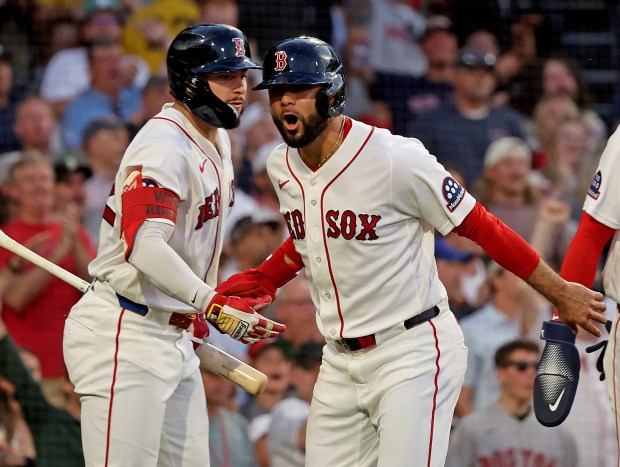 Boston, - May 27 - Boston Red Sox second baseman Isiah Kiner-Falefa (2) celebrates with right fielder Wilyer Abreu (52) after scoring during the fourth inning at Fenway Park. (Photo By Matt Stone/Boston Herald).