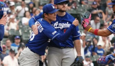 Jun 13, 2026; Chicago, Illinois, USA; Los Angeles Dodgers pitcher Yoshinobu Yamamoto (18) and third baseman Max Muncy (13) hug after Yamamoto leaves the game against the Chicago White Sox during the ninth inning at Rate Field. Mandatory Credit: David Banks-Imagn Images