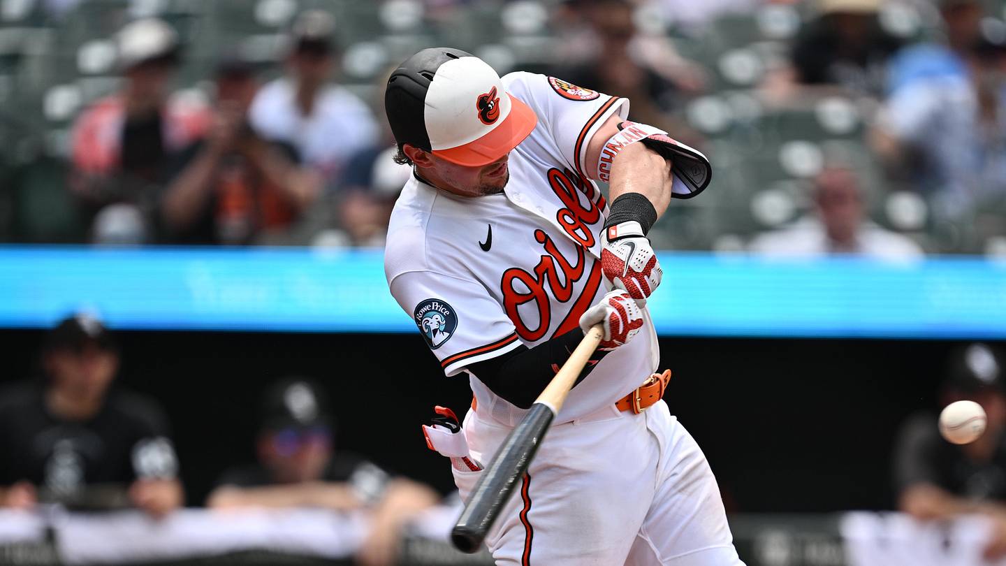 Jul 1, 2026; Baltimore, Maryland, USA;  Baltimore Orioles catcher Adley Rutschman (35) hits a RBI single in the fifth inning against the Chicago White Sox at Oriole Park at Camden Yards. Mandatory Credit: Jamie Sabau-Imagn Images