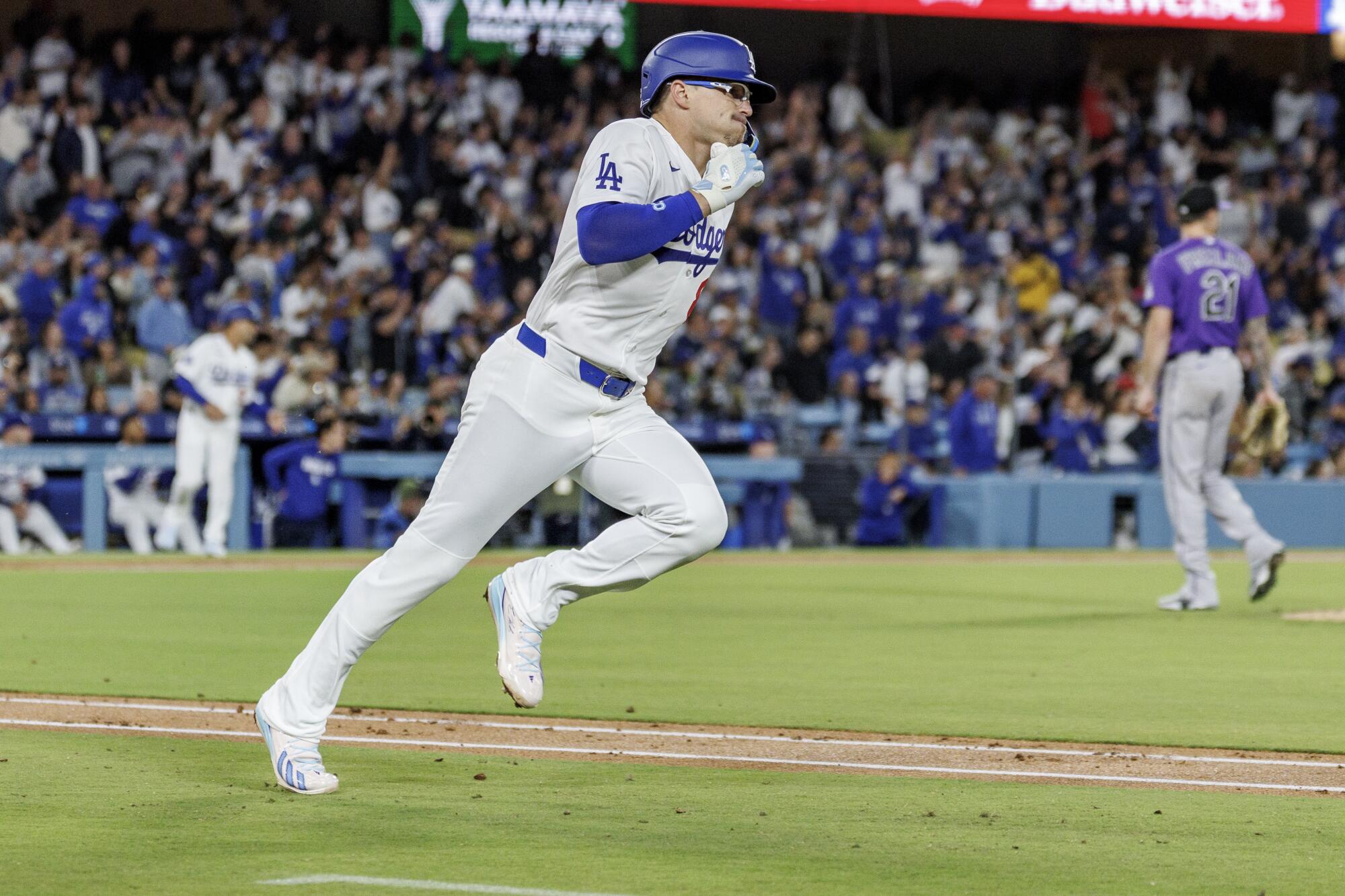 Kiké Hernández appears to wince after hitting a double against the Colorado Rockies on May 26.