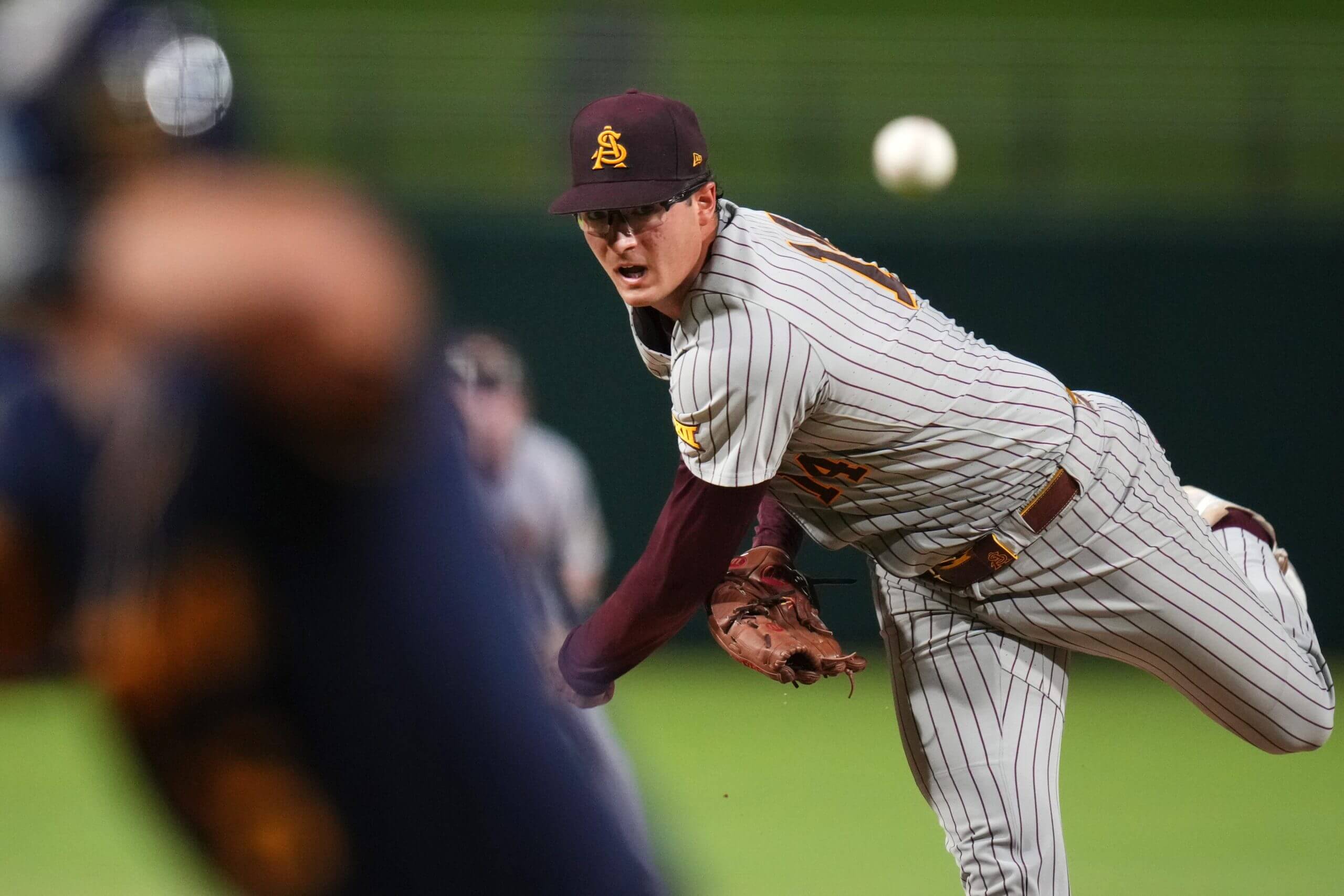 ASU Sun Devils left-hander Cole Carlon (14) pitches against the West Virginia Mountaineers during their Big 12 tournament game at Surprise Stadium on May 22, 2026. 