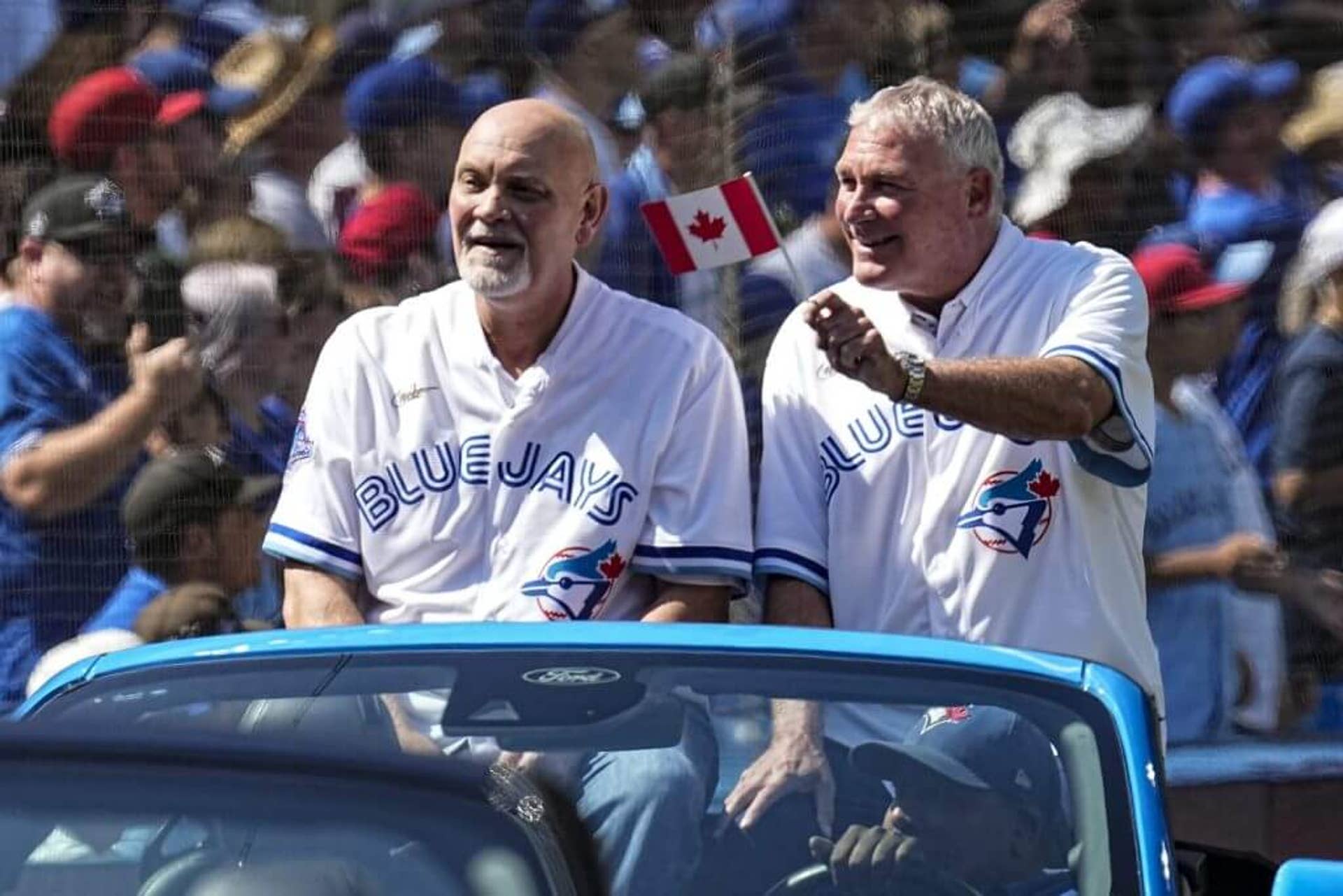 Duane Ward, left, and Dave Stieb wave to fans during a pregame ceremony honouring the 1992 World Series-winning team.