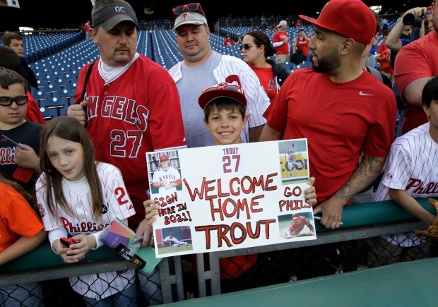Justin Shephard, 9, from Deptford, N.J., holds up a sign for Angels star Mike Trout before a game between the Angels and the Philadelphia Phillies on Tuesday, May 13, 2014, in Philadelphia. Trout said he always receives a warm reception in Philadelphia, which is not far from his hometown of Millville, N.J. (AP Photo/Laurence Kesterson)