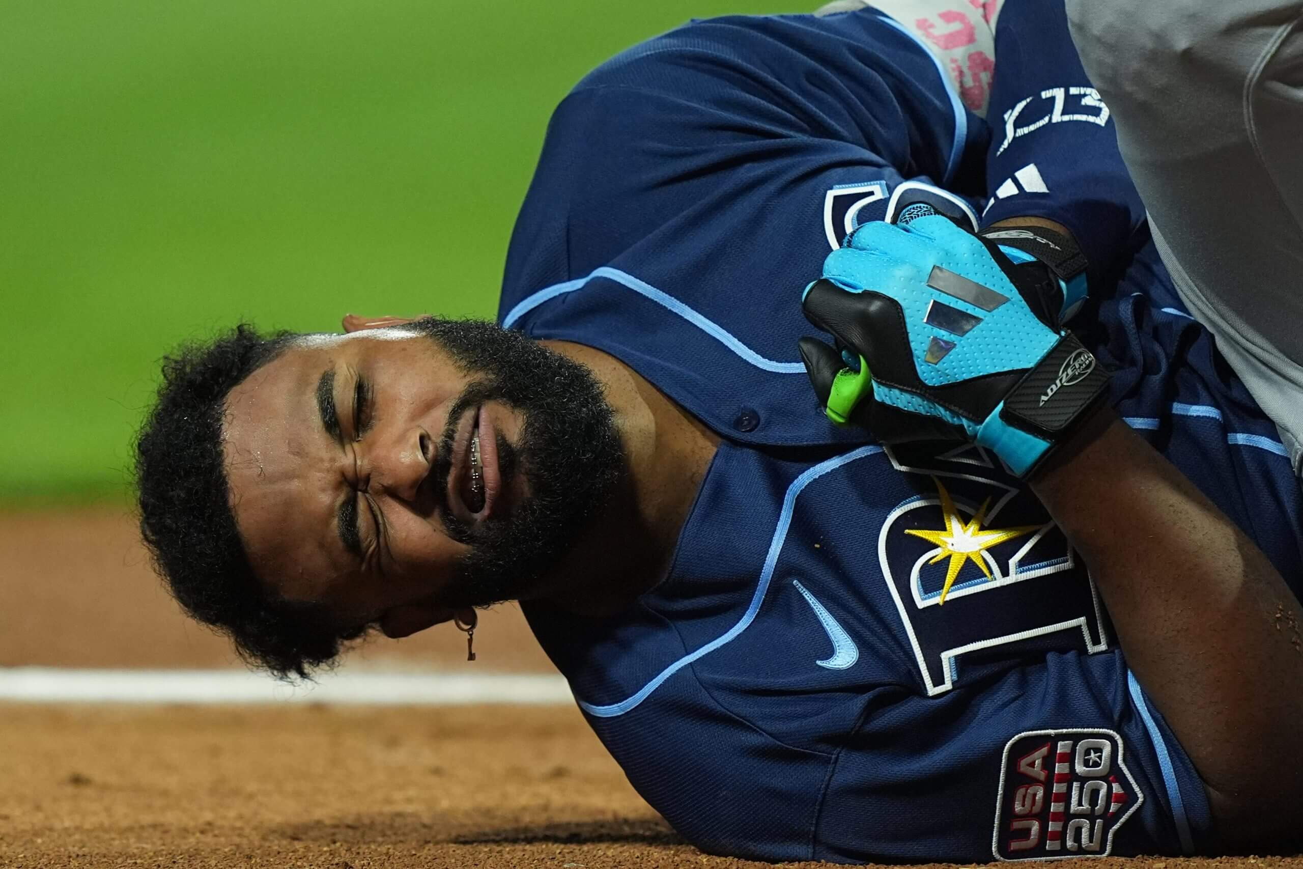 Junior Caminero reacts after being hit by a pitch.