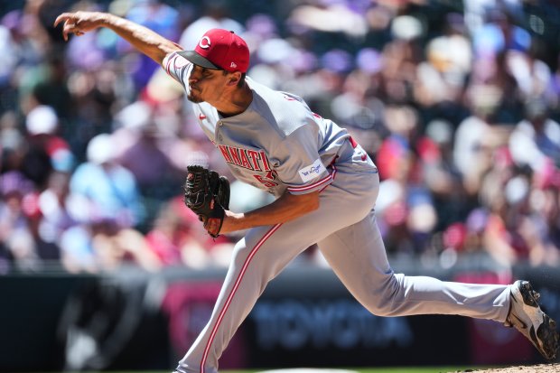 Cincinnati Reds relief pitcher Julian Garcia works against the Colorado Rockies in the third inning of a baseball game in Denver, Saturday, July 18, 2026. (AP Photo/David Zalubowski)