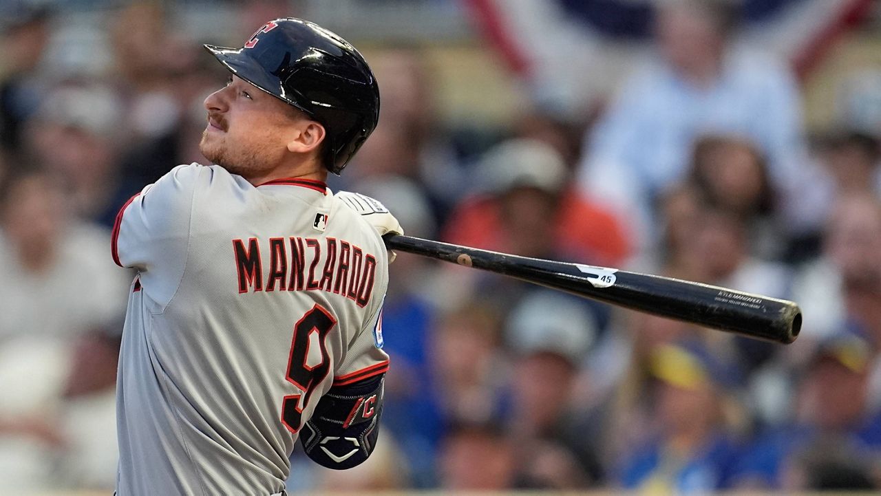 Cleveland Guardians' Kyle Manzardo (9) hits a single against the Minnesota Twins in the third inning of the second baseball game of a doubleheader, Saturday, Sept. 20, 2025, in Minneapolis. (AP Photo/Mike Stewart)