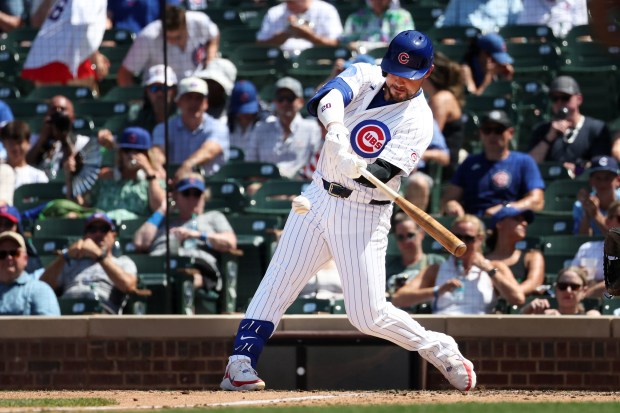 Cubs designated hitter Michael Conforto (20) hits a home run against the Padres in the fifth inning at Wrigley Field on July 1, 2026. (Terrence Antonio James/Chicago Tribune)