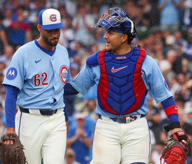 Cubs reliever Antoine Kelly (62) is congratulated by catcher Miguel Amaya after striking out the last batter with two runners on base in the top of the eighth inning against the Yankees on Friday, July 31, 2026, at Wrigley Field. Kelly made his major-league debut in the Cubs' 2-0 loss. (Stacey Wescott/Chicago Tribune)