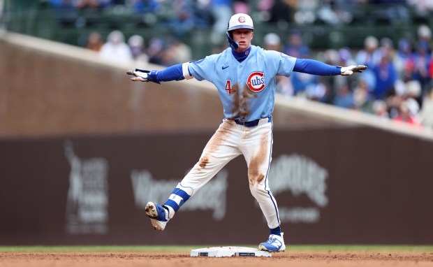 Chicago Cubs center fielder Pete Crow-Armstrong signals the safe sign after advancing to second base following a single in the fourth inning of a game against the Arizona Diamondbacks at Wrigley Field in Chicago on May 1, 2026. (Chris Sweda/Chicago Tribune)