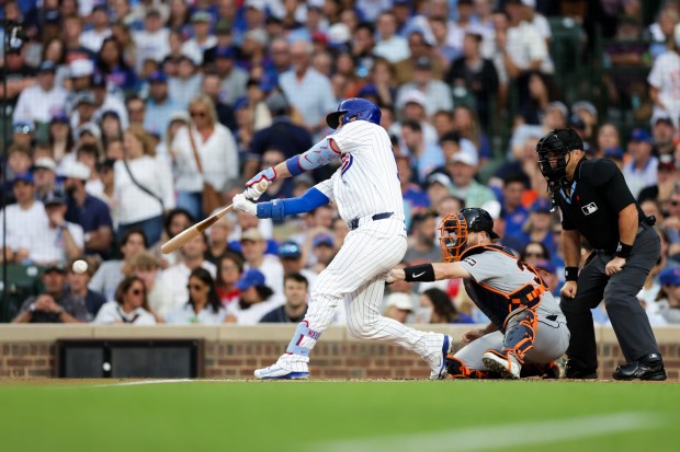Cubs catcher Carson Kelly (15) hits a two RBI single during the first inning against the Tigers at Wrigley Field July 21, 2026 in Chicago. (Armando L. Sanchez/Chicago Tribune)