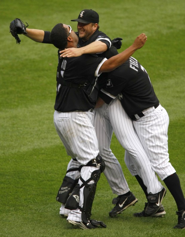 White Sox catcher Ramon Castro and first baseman Josh Fields celebrate with pitcher Mark Buehrle after the last out against the Tampa Bay Rays at U.S. Cellular Field in Chicago. Buehrle threw a perfect game. The Sox won 5-0. (Phil Velasquez/Chicago Tribune)