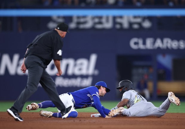 White Sox pinch runner Luisangel Acuña is tagged out at second base by the Blue Jays' Ernie Clement on a steal attempt in the eighth inning Saturday, July 18, 2026, in Toronto. (Vaughn Ridley/Getty)