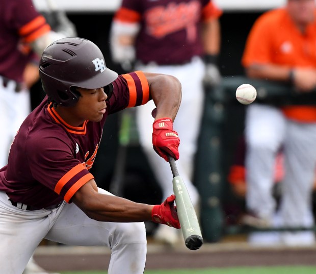 Brother Rice's Zion Rose (4) squares up to bunt against McHenry in the Class 4A third-place game at Slammers Stadium in Joliet on Saturday, June 11, 2022. (Rob Dicker / Daily Southtown)