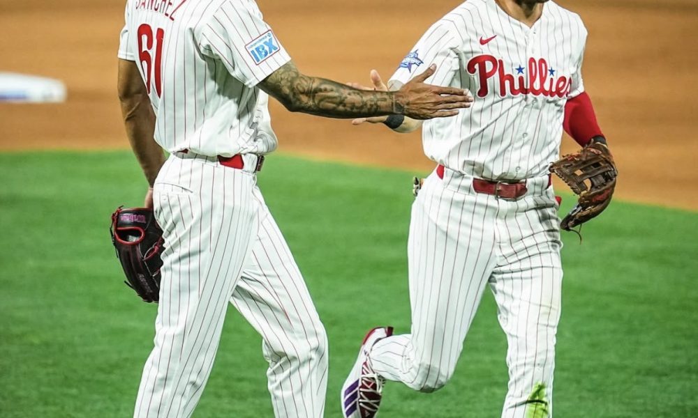 Phillies' left-handed starter Cristopher Sánchez high-fives shortstop Trea Turner. Image courtesy of Phillies' Instagram account.