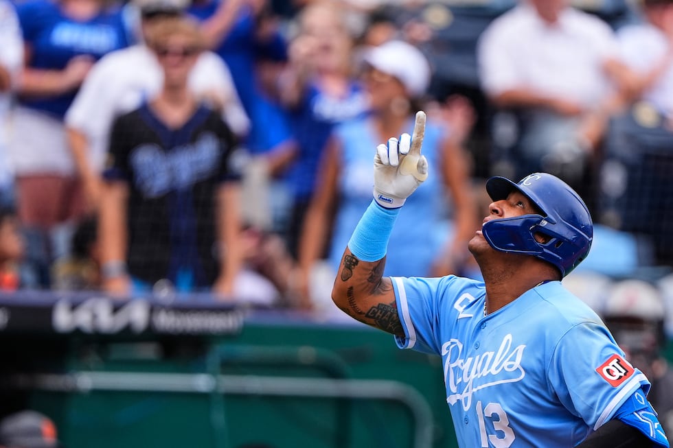 Kansas City Royals' Salvador Perez celebrates after hitting a two-run home run to tie George...
