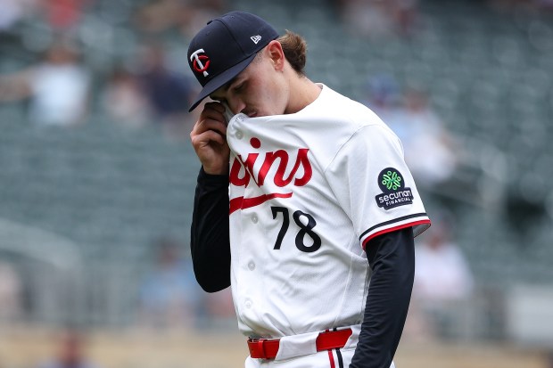 Andrew Morris wipes his face