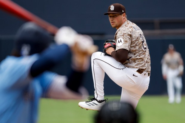 Mason Miller #22 of the San Diego Padres pitches against the Toronto Blue Jays during the ninth inning at Petco Park on Sunday, July 12, 2026 in San Diego, California. (Meg McLaughlin / The San Diego Union-Tribune)