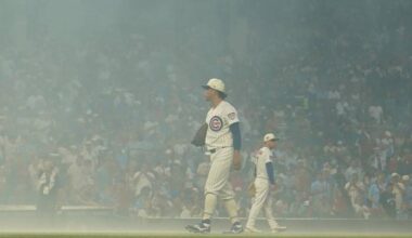 Cubs fans sing `Take Me Home, Country Roads' during fog delay at Wrigley Field