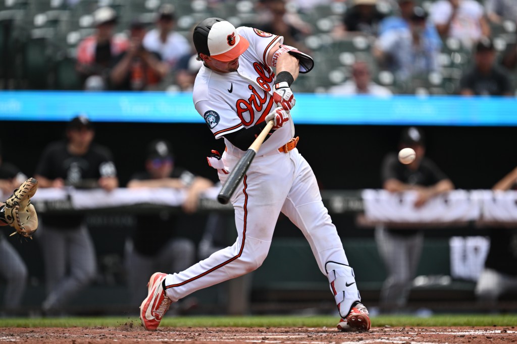 Baltimore Orioles catcher Adley Rutschman hits an RBI single.