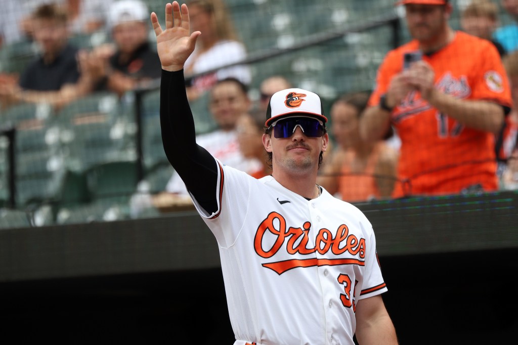 Baltimore Orioles catcher Adley Rutschman waves to fans.