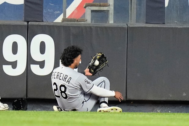 Chicago White Sox's Everson Pereira (28) runs into the wall to catch a ball hit by New York Yankees' Ben Rice for an out during the seventh inning of a baseball game Wednesday, June 17, 2026, in New York. (AP Photo/Frank Franklin II)