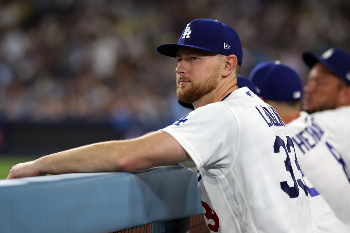 Jul 29, 2026; Los Angeles, California, USA; Los Angeles Dodgers pitcher Eric Lauer (33) watches a game from the dugout during the seventh inning against the Seattle Mariners at Dodger Stadium. Mandatory Credit: Kiyoshi Mio-Imagn Images