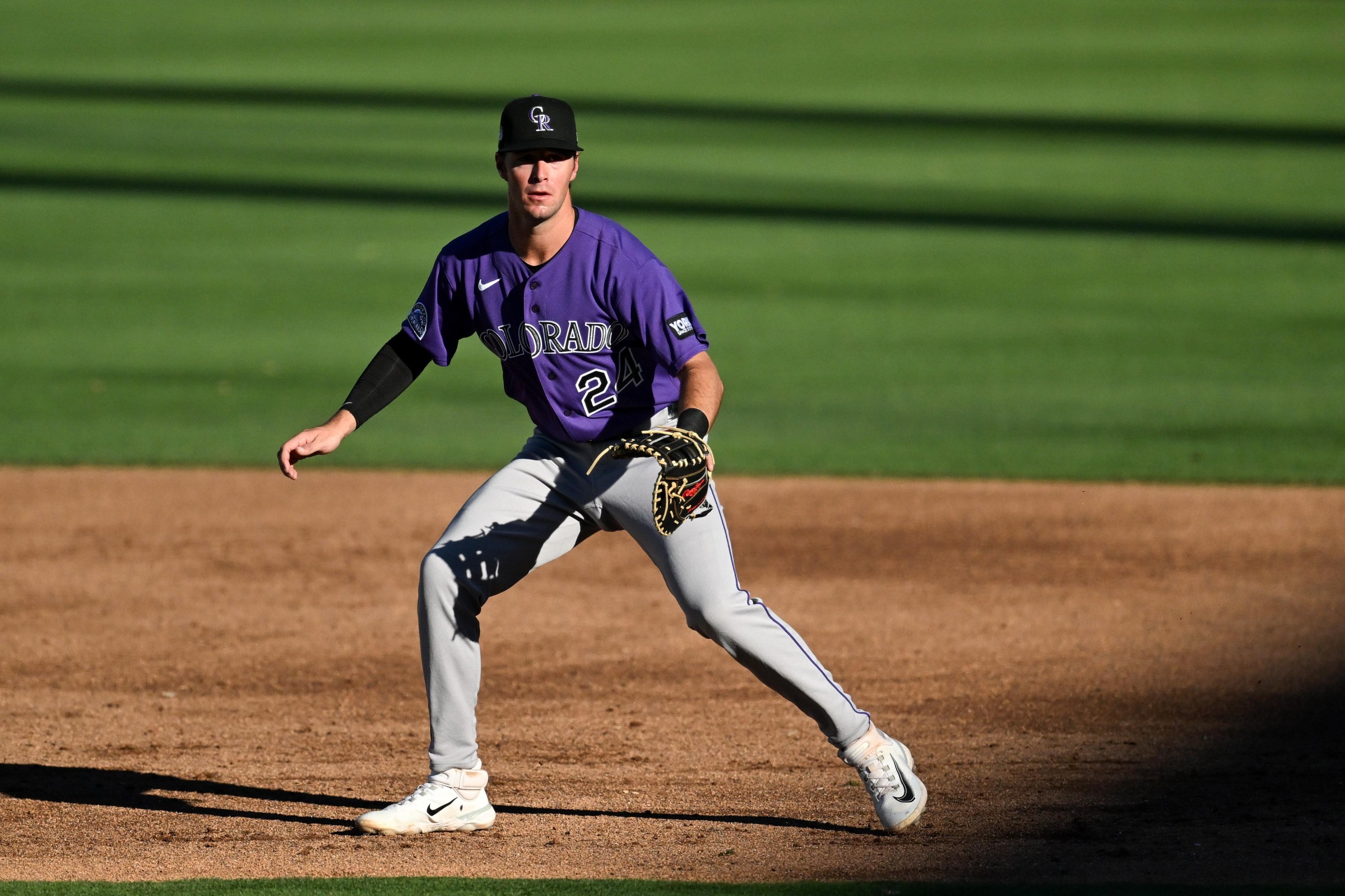 SCOTTSDALE, ARIZONA - MARCH 21: Charlie Condon #24 of the Colorado Rockies in the field during the second inning of a spring training Spring Breakout game against the Arizona Diamondbacks at Salt River Fields at Talking Stick on March 21, 2026 in Scottsdale, Arizona. (Photo by Chris Bernacchi/Diamond Images via Getty Images)