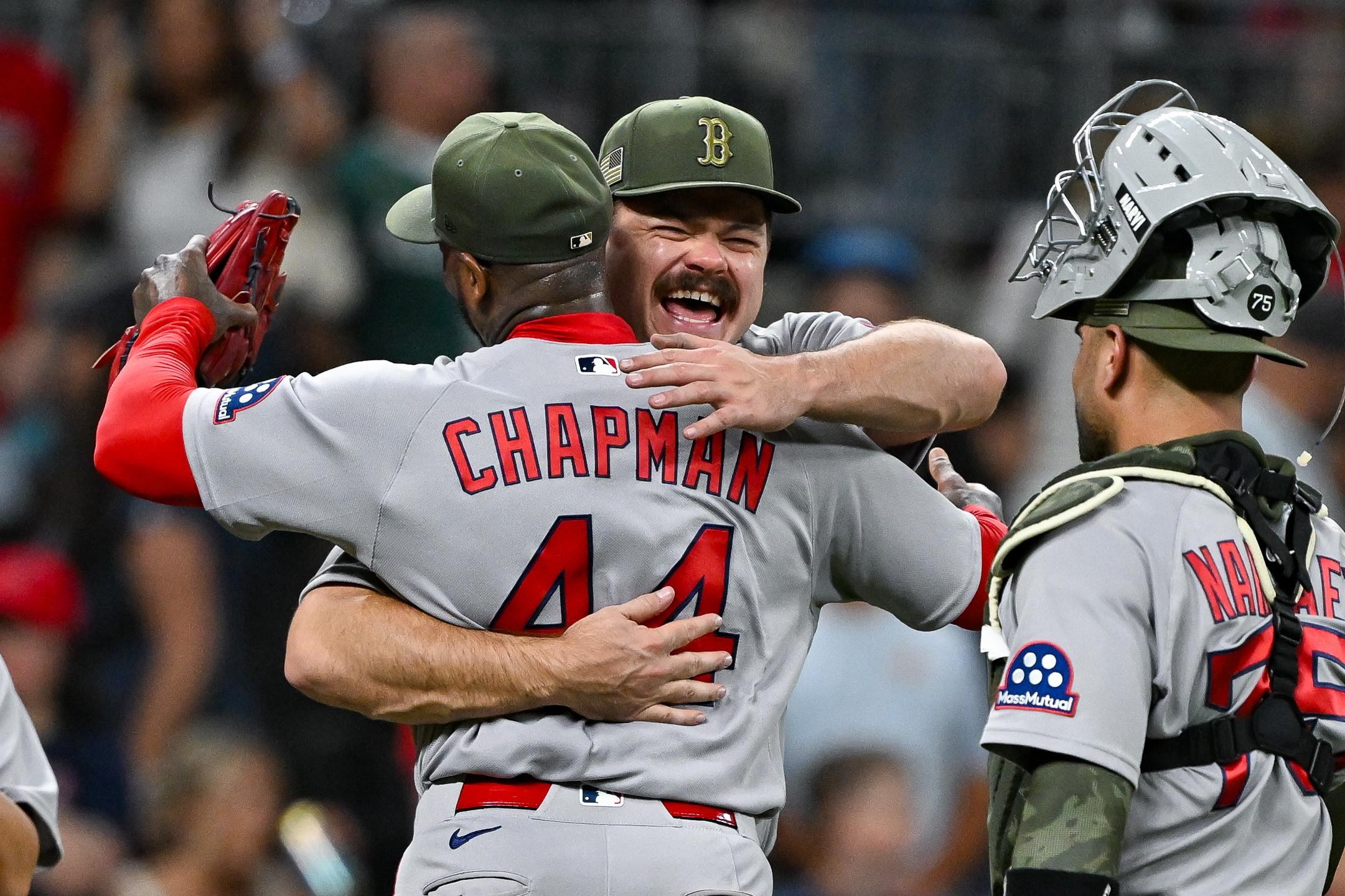 ATLANTA, GA - MAY 16: Boston pitcher Payton Tolle (70) embraces pitcher Aroldis Chapman (44) following the conclusion of the during the MLB game between the Boston Red Sox and the Atlanta Braves on May 16th, 2026 at Truist Park in Atlanta, GA. (Photo by Rich von Biberstein/Icon Sportswire via Getty Images)