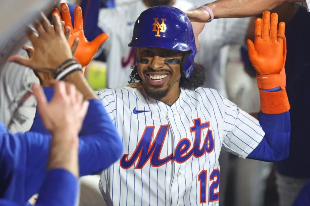 Francisco Lindor is all smiles as he celebrates with teammates after hitting a three-run home in the eighth inning of the Mets' blowout win over the Braves on July 27, 2026 at Citi Field.