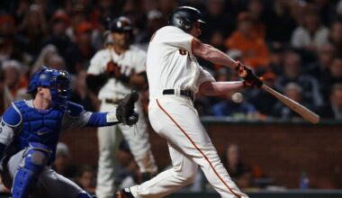 Oct 14, 2021; San Francisco, California, USA; San Francisco Giants pinch hitter Alex Dickerson (12) strikes out against the Los Angeles Dodgers in the seventh inning during game five of the 2021 NLDS at Oracle Park. Mandatory Credit: D. Ross Cameron-USA TODAY Sports