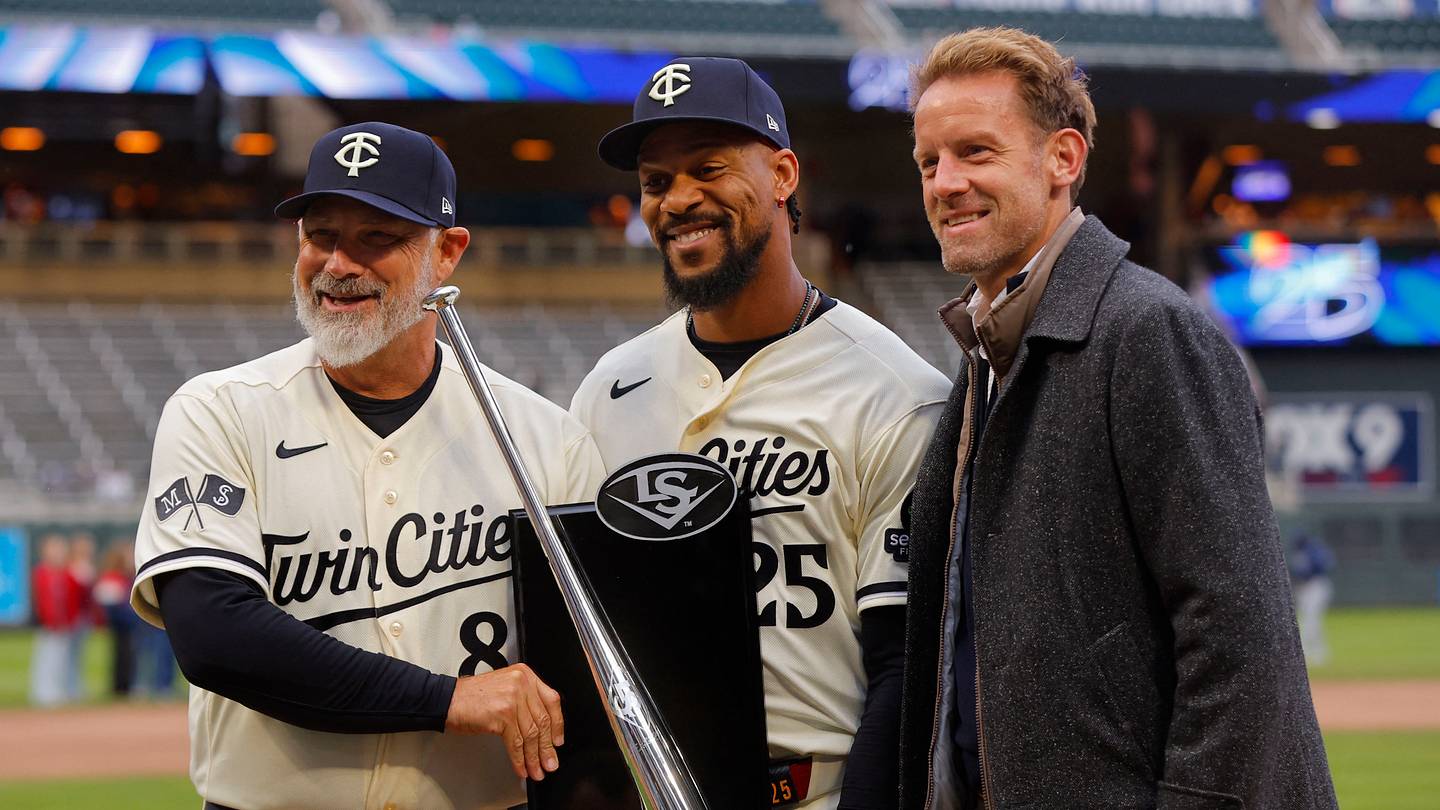 Apr 4, 2026; Minneapolis, Minnesota, USA; Minnesota Twins designated hitter Byron Buxton (25) displays his 2025 silver slugger award with manager Derek Shelton and owner Tom Pohlad before the game with the Tampa Bay Rays at Target Field. Mandatory Credit: Bruce Kluckhohn-Imagn Images