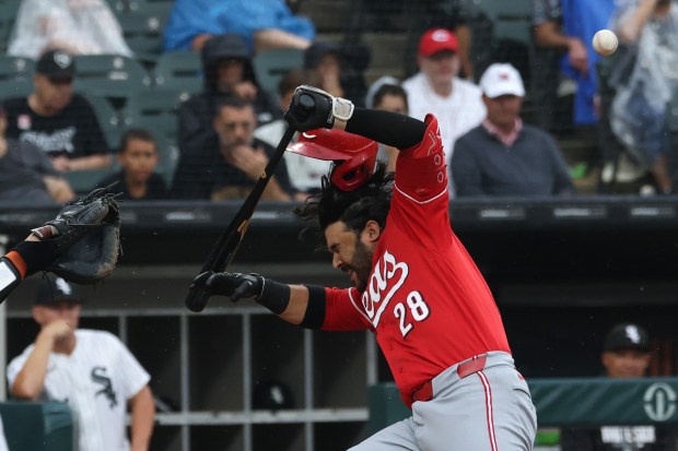 Reds designated hitter Eugenio Suárez is hit by a pitch from White Sox reliever Tanner McDougal in the sixth inning, resulting in a run scored, on Thursday, Aug. 13, 2026, at Rate Field. It was McDougal's major-league debut. (John J. Kim/Chicago Tribune)